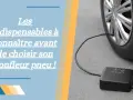Gonfleur de pneu noir connecté à une roue de voiture sur fond gris.
